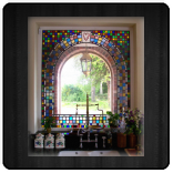 Kitchen window with arch design to reflect the architecture seen through the window